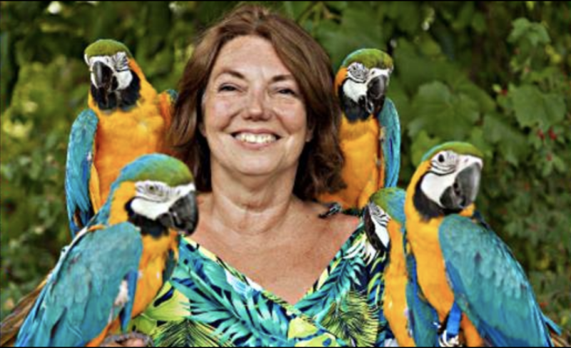 Gloria Waslyn with Parrot family